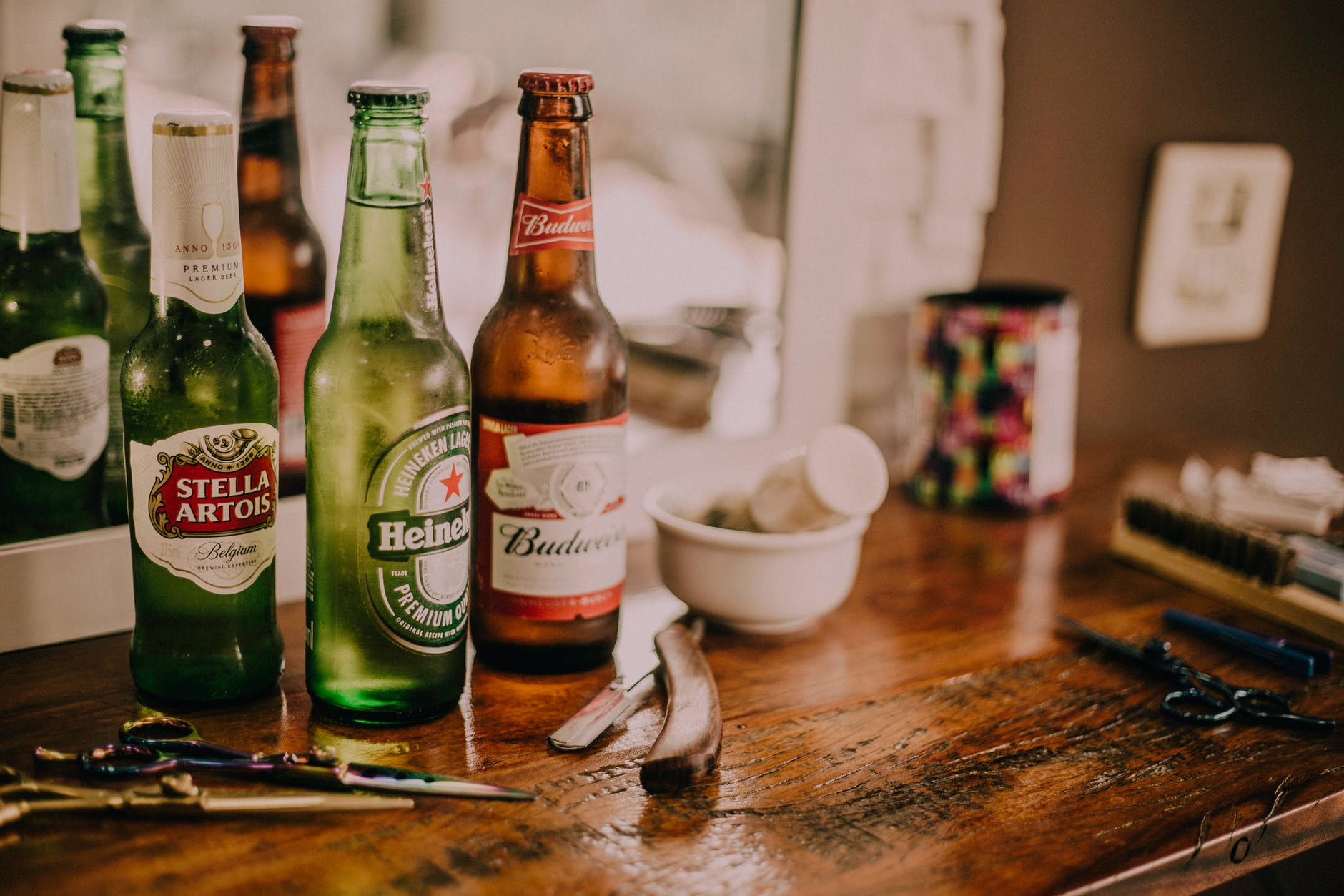 Image shows bottles of beer on a work surface